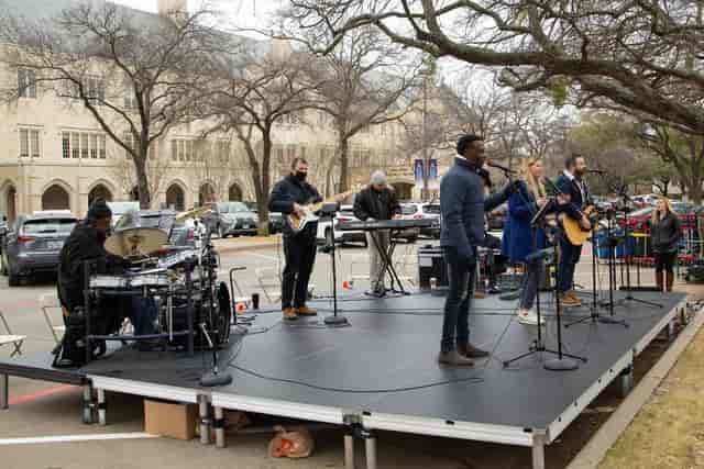 Live music setup on outdoor stage at Highland Park United Methodist Church for events.