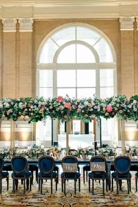 Outdoor Covered Loggia at Union Station with vibrant floral arrangement for upscale weddings.