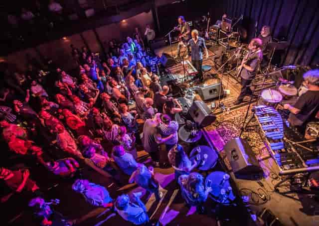 Vibrant live music event at The Kessler Theater with engaged audience and dynamic lighting.