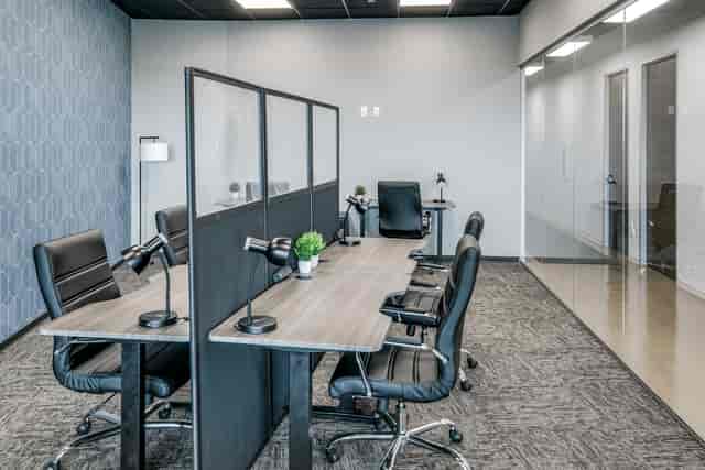 Modern small team offices with organized desks for meetings and workshops.
