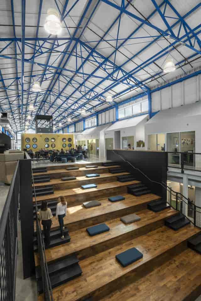 Modern First Floor Event Space with tiered seating for workshops and networking.