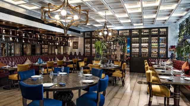 Upscale dining in COYA Doha with plush seating for private events and meetings.