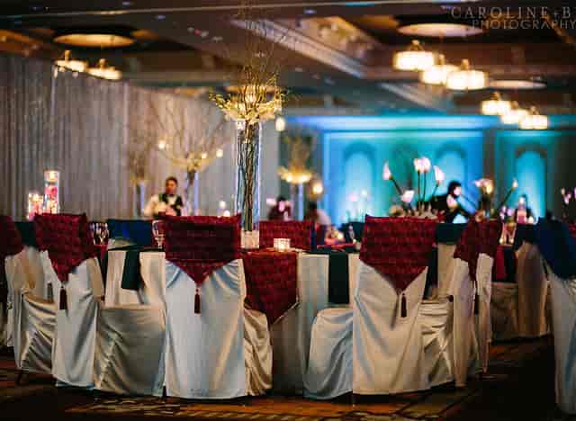 Elegant banquet hall with floral centerpieces for weddings and upscale events.