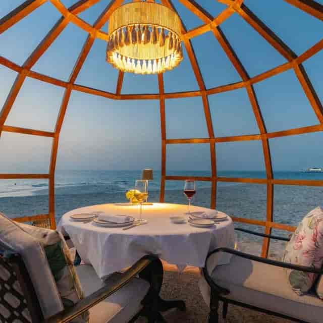Elegant beachfront dining setup at French Riviera, perfect for intimate events and gatherings.