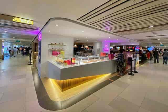 Vibrant retail shop in Tarte by Cheryl Koh, perfect for networking events and casual meetings.
