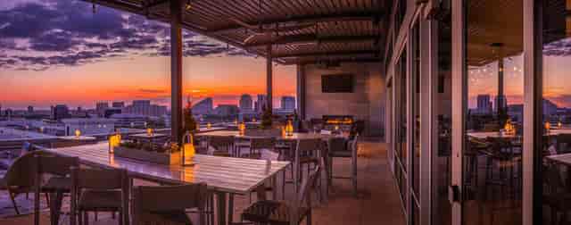 "Rooftop Lounge in Upside West Village, stylish seating for sunset cocktails and events."