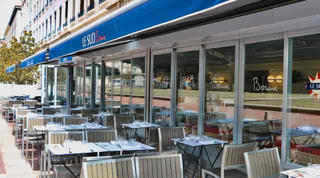 Outdoor seating at Brasserie Le Sud, perfect for meetings and networking events.