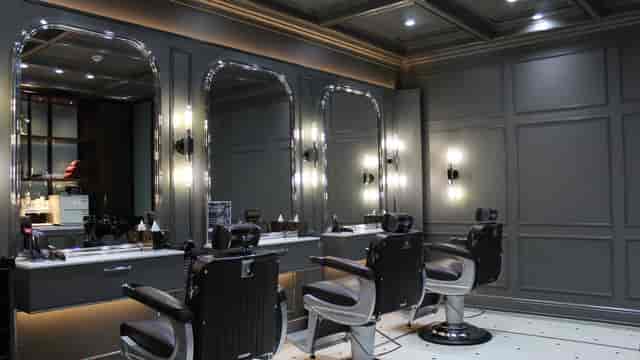 Sleek barbershop interior at The Lunatic Fringe for networking and grooming events.