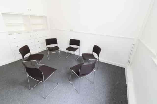 F16 Meeting Room at Friends' Meeting House, minimalist design for workshops and discussions.