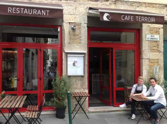 Charming Café Terroir with cozy outdoor seating for casual networking events.