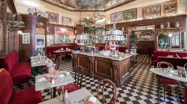 Charming restaurant dining room with warm decor, perfect for networking events or casual lunches.