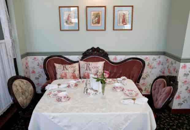 Elegant tea salon set for intimate gatherings and upscale events in charming venue.