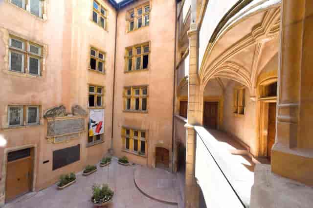 Charming courtyard at Musée de l'Imprimerie for networking events and meetings.