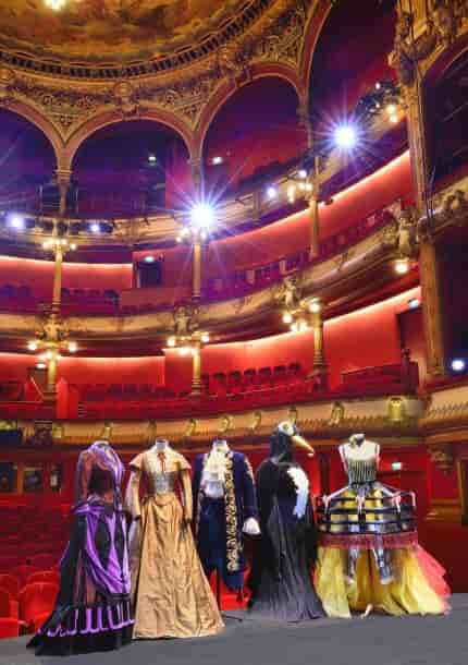 Vibrant theatre stage with costumes for immersive performances and gala events.