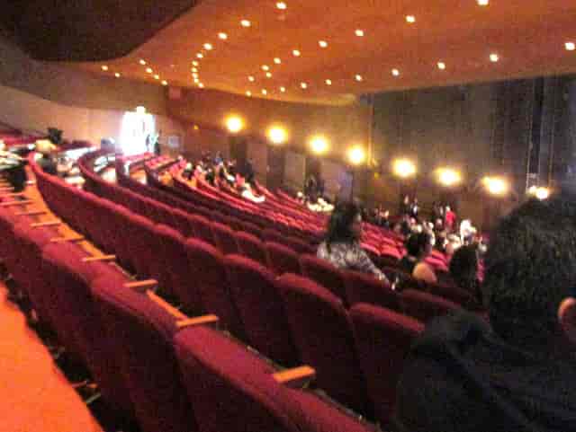 Concert hall auditorium with tiered seating, perfect for performances and presentations.