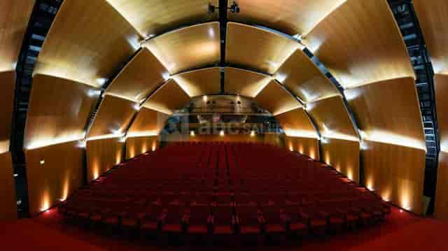 Modern lecture hall with tiered red seating at Centre de Congrès de Lyon for events.