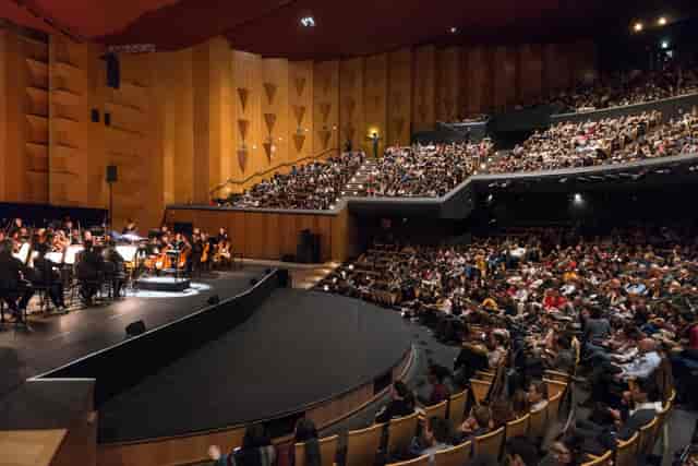 Packed Auditorium de Lyon with orchestra, perfect for cultural events and performances.
