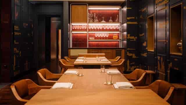 Elegant dining space with warm wood tones, perfect for private meetings and VIP dinners.