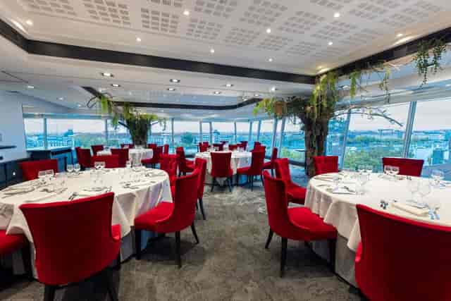 Elegant event space at Sofitel Lyon Bellecour with round tables and city views.