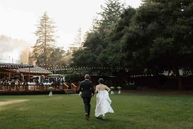Outdoor wedding at The Mountain Terrace with strings of lights and lush greenery.