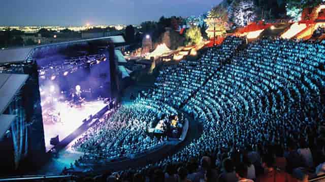 Vibrant Grand théâtre amphitheater at Nuits de Fourvière, ideal for concerts and performances.