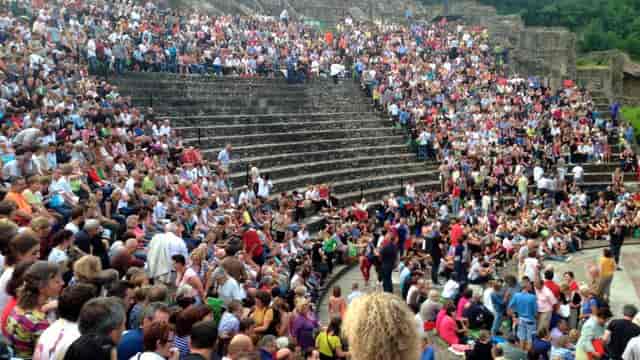 Outdoor amphitheater in Nuits de Fourvière with engaged audience for events and gatherings.