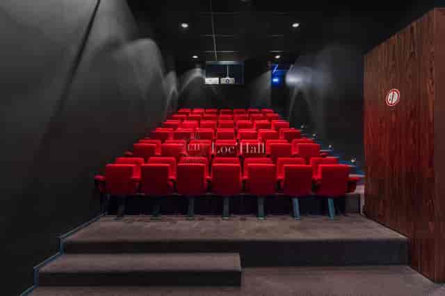 Sleek Maison de la Danse theater with red seats, ideal for corporate events and screenings.
