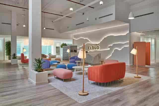 Modern co-working space with vibrant decor for workshops and brainstorming sessions.