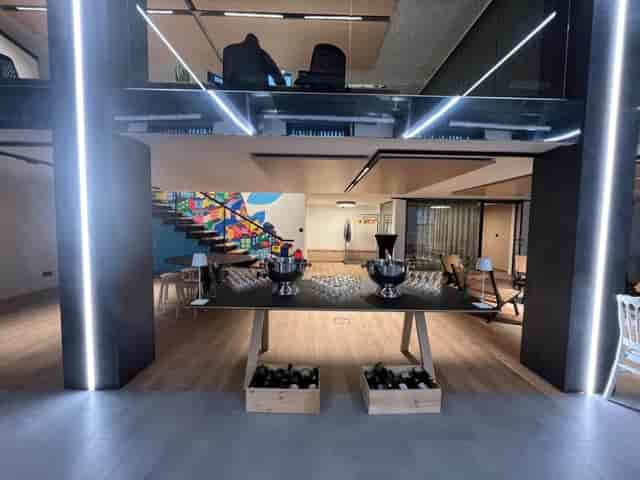 Modern conference room with beverage station at Espace Coworking for networking events.