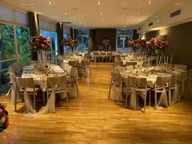 Elegant banquet hall at Château de Montchat with round tables, ideal for receptions and celebrations.