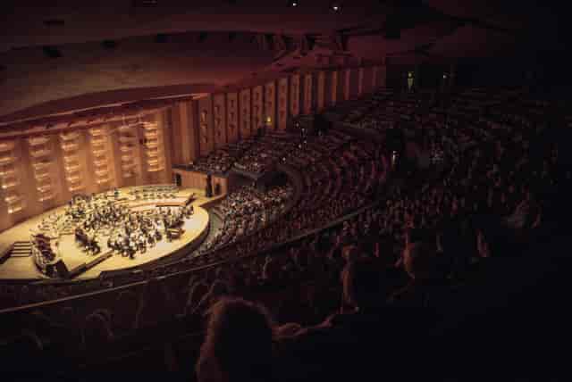 Packed Auditorium de Lyon concert hall with vibrant lighting and excellent acoustics.