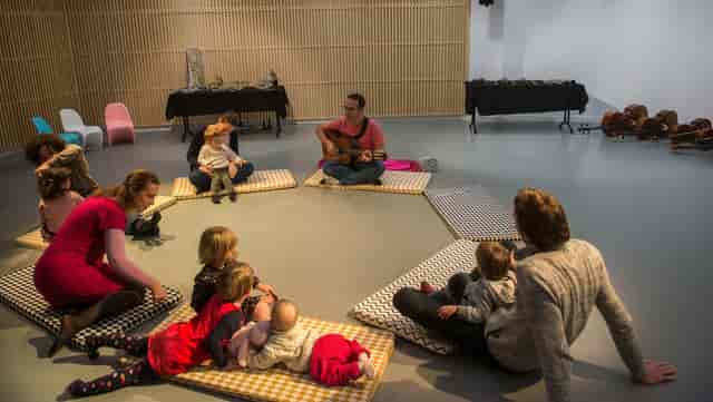 Cozy interactive space at Auditorium de Lyon for family music events with children.