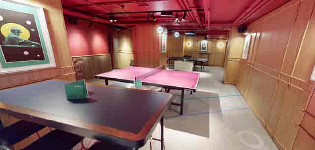 Vibrant event space with ping pong tables at The Hideaway, Battersea Power Station.