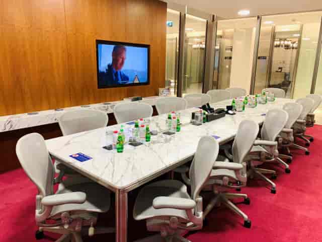 Modern meeting room with marble table, ideal for corporate events and presentations.