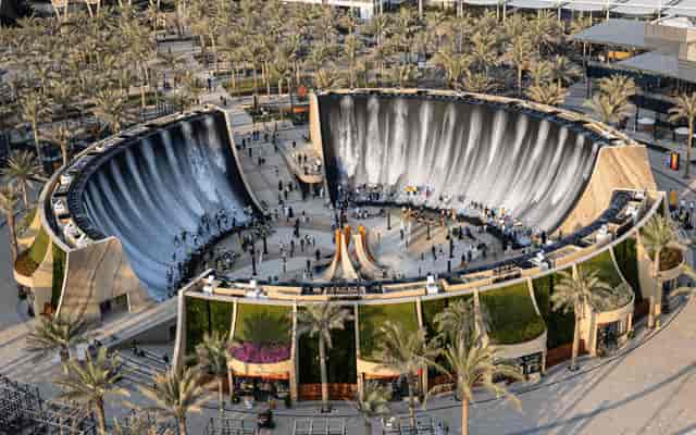Surreal Expo City Dubai venue with central waterfall, ideal for outdoor events and exhibitions.