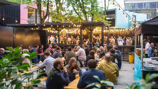 Patio at Quarter House: vibrant outdoor event space with communal seating for networking.