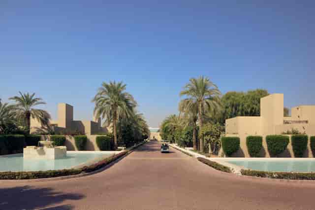Elegant venue entrance at Chukka, surrounded by water features and palm trees for events.