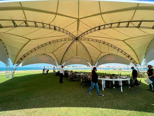 Spacious outdoor tent setup for corporate retreats and upscale events.