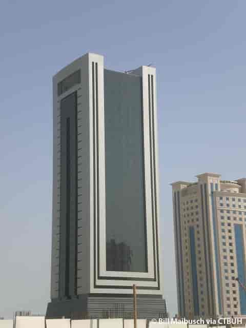 Sleek glass skyscraper in Alsahab Building for corporate events and meetings.