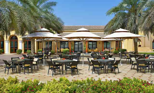 Palermo Terrace outdoor dining area at Dubai Polo Club, ideal for events and gatherings.