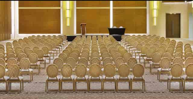 Banquet hall at Hilton Riyadh Hotel with elegant chairs for conferences and seminars.
