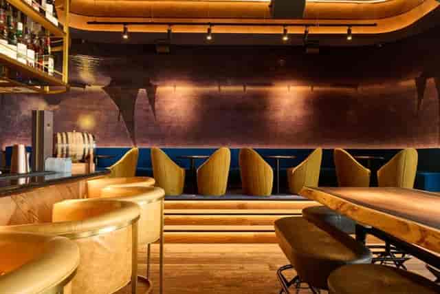 Private dining room at Hunter & Barrel, featuring plush seating for intimate events.