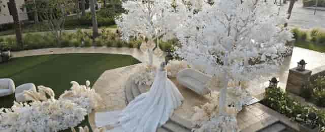 Outdoor wedding ceremony at Four Seasons Dubai with elegant floral installations.