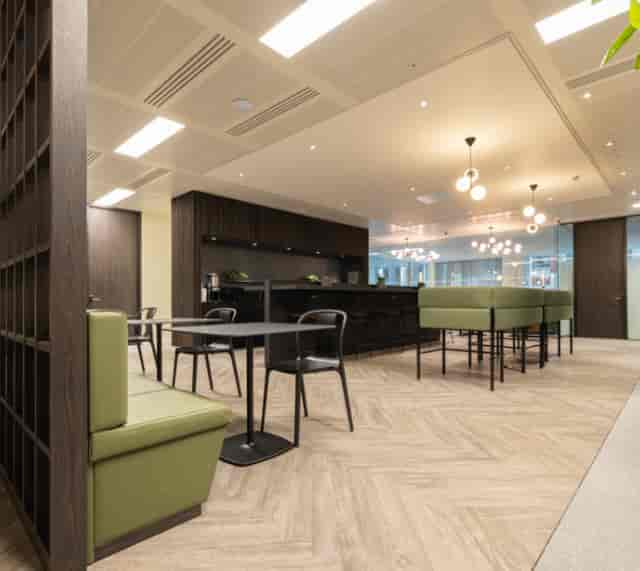 Modern office meeting space in Gilbanks Manchester with sleek furnishings, ideal for networking events.