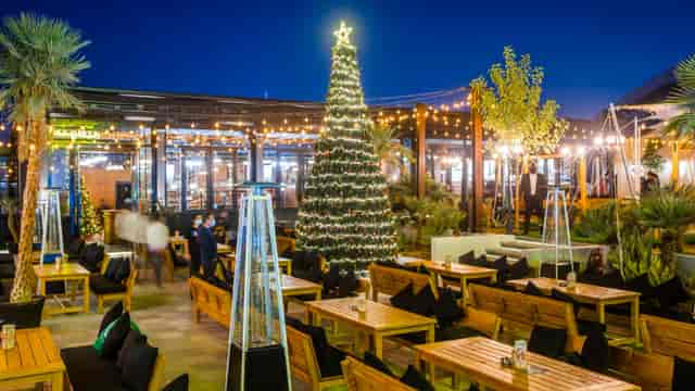 Soho Garden outdoor event space with festive lights and Christmas tree for holiday parties.
