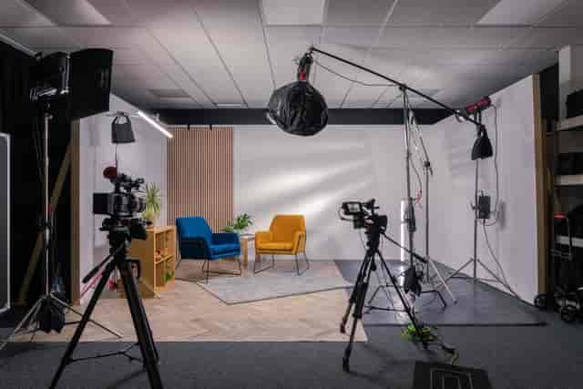 Hybrid event studio with professional lighting, ideal for webinars and interviews.