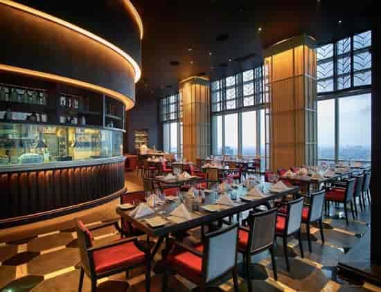 Sophisticated dining space with panoramic views for corporate dinners and upscale events.