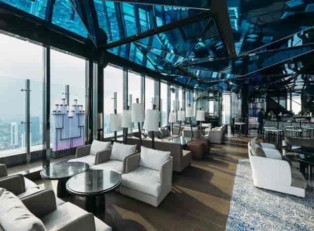 Sophisticated rooftop bar with skyline views, perfect for corporate events and gatherings.
