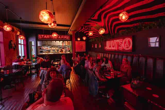 Vibrant bar in Jimmy's Manchester, ideal for casual meetings and social gatherings.