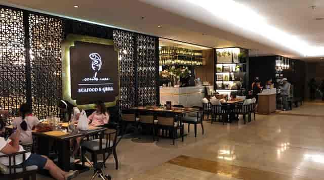 Stylish seafood restaurant dining area with warm lighting for gatherings and meetings.